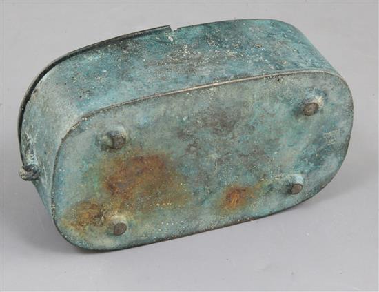 A Chinese archaic bronze portable lamp, Han dynasty, 2nd century B.C.- 2nd century A.D. 15cm long, hole to cover